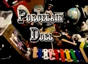 porcelain doll still from video